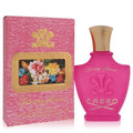 AuraGlow Creed Spring Flower eau de parfum for women in a bright pink bottle with gold cap and matching floral box.