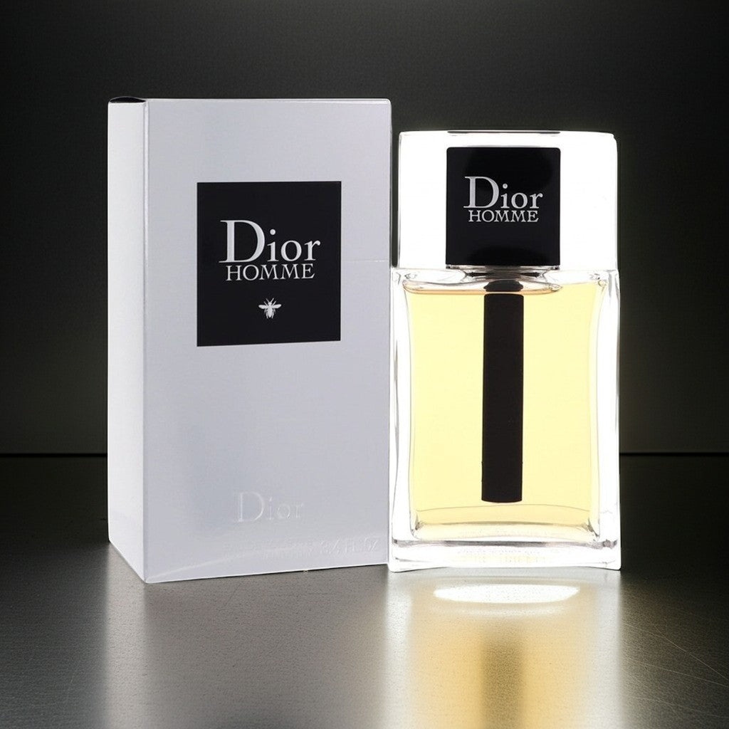 AuraGlow Dior Homme Eau De Toilette 3.4oz bottle and white box featuring iris, leather, and amber fragrance notes.