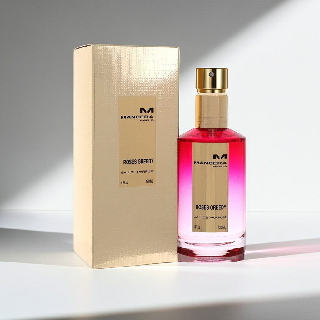 AuraGlow Mancera Roses Greedy unisex eau de parfum bottle and gold box on a white surface with soft shadows.