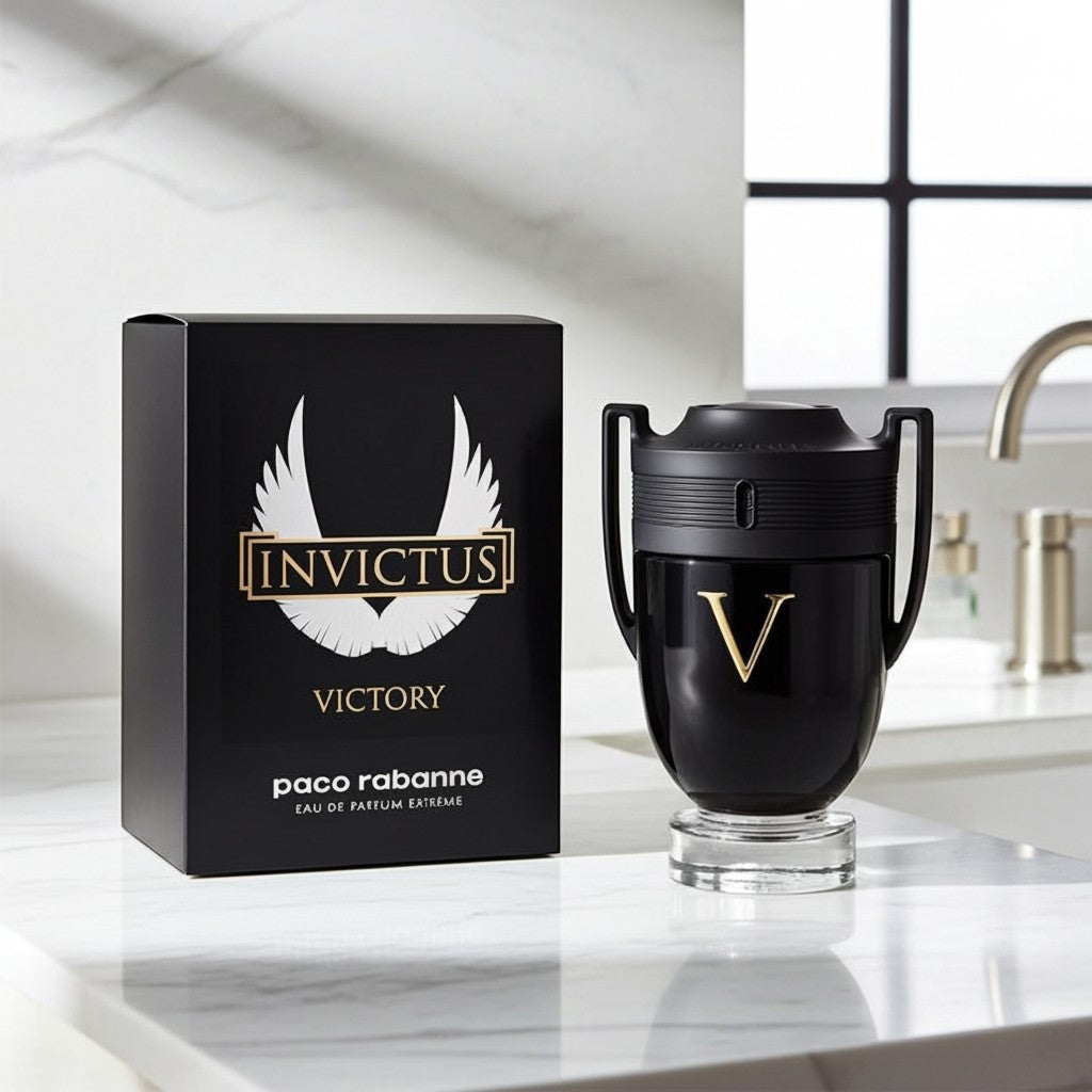 AuraGlow Paco Rabanne Invictus Victory Eau de Parfum Extreme bottle and black box on a marble bathroom counter.