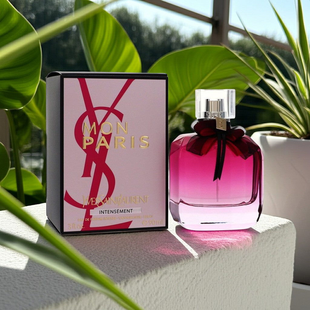 AuraGlow YSL Mon Paris Intensement perfume bottle and box with a dark pink gradient glass and black bow detail.